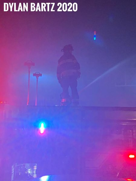 Firefighter at night fire scene