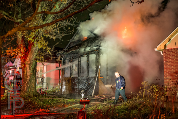 Detroit Firefighters battle a dwelling fire at night