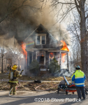 vacant house engulfed in flames